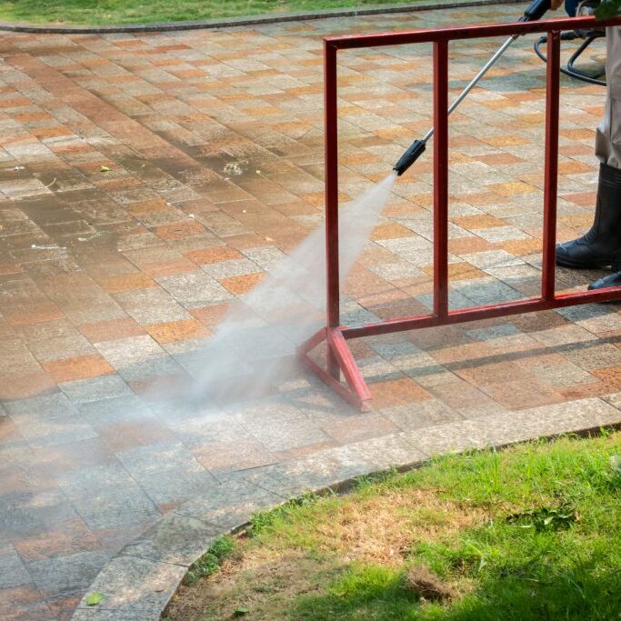 Outdoor floor cleaning with a pressure water jet on street