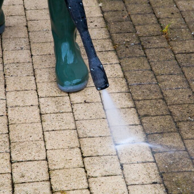Outdoor floor cleaning with high pressure water jet